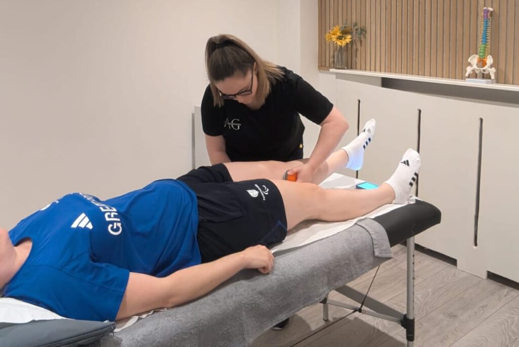 Sports rehabilitation therapy session using soft tissue treatment for muscle recovery Physiotherapy treatment targeting lower limb injury pain management and mobility Injury rehabilitation session improving circulation flexibility and musculoskeletal function Manual therapy technique enhancing recovery strength and functional movement patterns Clinical physiotherapy supporting injury recovery rehabilitation and performance optimisation